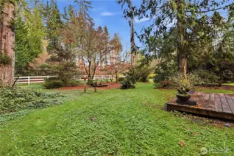 How beautiful is this backyard.  Crisp white split rail, fencing, and beautiful fall colors.