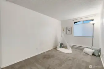 The bedrooms are large and feature top-down bottom-up blinds so you can enjoy light and privacy. The closet is located to the left