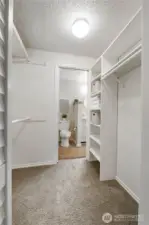 The walk-in closet has tons of space and handy built-in shelving