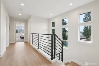 Lots of windows to bring natural light. Hardwood floors were brought all the way to the bedrooms