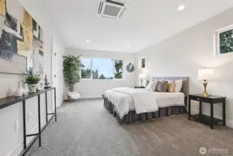 Primary bedroom with individual heating/cooling tucked in ceiling