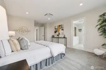 Primary bedroom leading to primary bathroom