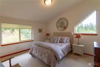 Upstairs  Secondary Bedroom with Tons of Natural Light and Walk In Closet