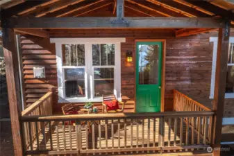 Large window overlooks the south yard and looks down East Sound-see water reflected in the door. Cozy area as-is............. or Imagine expanding this deck to create more outdoor space.