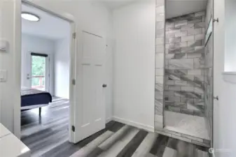 Primary bathroom with beautiful walk in shower.. Transom window allows light into the shower so its nice and bright inside!