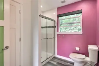 Upstairs Shower .. there is a closet behind the door for additional storage . Good space!