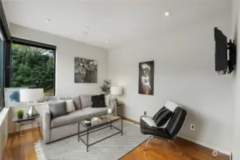 Home Office/Flex Room: This versatile space can be used as a home office, gym, or both. Large window allow natural light to flood the room, providing inspiring views of the outdoors.