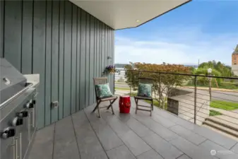 Deck offers outdoor leisure with this beautifully designed space that connects to the living room perfect for entertaining guests or enjoying the breeze. The built-in stainless steel grill adds a touch of luxury, making outdoor dining a delightful experience.