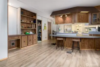 Eat-in bar at the kitchen.  Built-in desk and storage make a great little office space.