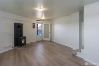 Flexible daylight basement space with propane stove and separate beach access.