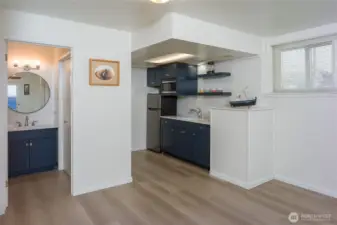 New kitchen/bath cabinets, refrigerator and counters.