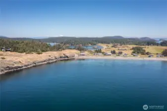 Long distance view of the neighborhood with Barlow Bay and MacKaye Harbor in the background with this home right in the middle of the picture.