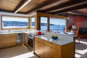 New kitchen includes all stainless appliances with induction stove, quartz counters, plank floors and beautiful cabinets.