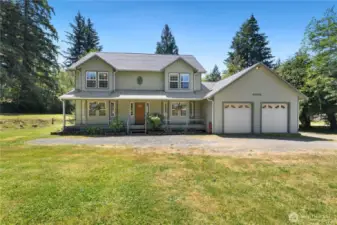 Your beautiful home sits on 1.41 acres of slightly sloping land.  Sit on your covered front porch protected from sun or rain.  It is already wired so your holiday lights come on with a flick of a switch!