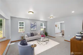 To the left as you enter is a spacious living room, perfect for conversation or quiet time