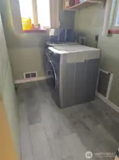 New utility room off the kitchen with new floorings.