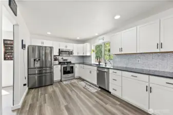 Full tile back splash and lots of cabinetry.