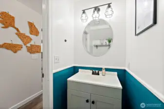 Half bath on main level with vanity storage.