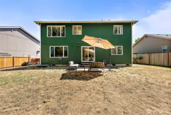 Spread out in the oversized back yard, fully fenced.
