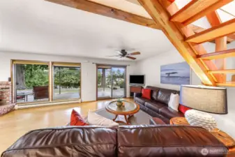 Cozy downstairs living room with natural light, enjoy the peaceful views.