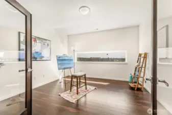 French doors lead into this flexible room for office, art studio space.