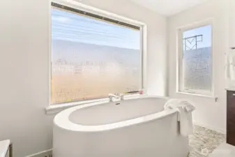 Giant stand alone soaking tub on your luxurious ensuite primary bath