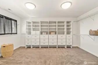 Inside the walk-in closet of the primary suite. Your inner Carrie Bradshaw will love it here!
