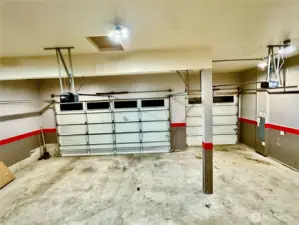 Three car garage with tall ceilings and lots more room for storage.