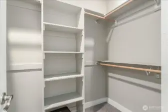 Primary bedroom walk in closet