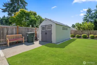 Outbuilding for extra garden tool storage and near the raised garden beds