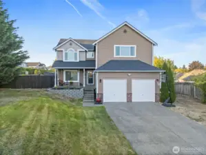 Two-car garage, long driveway and RV space on the right side of house offer tons of parking