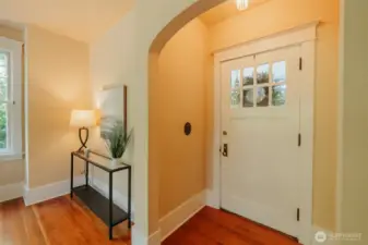 Enter through the first of many coved archways gracing the home.