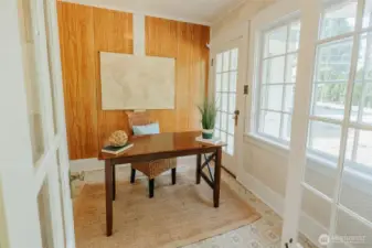 Once a side porch and entry, this room off the sun room was most recently used as an office.