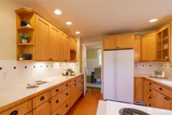 Smartly appointed kitchen was well designed to honor the home and flow well into the family room addition. This long counter expanse is perfect for day to day prep and for laying out a party buffet!