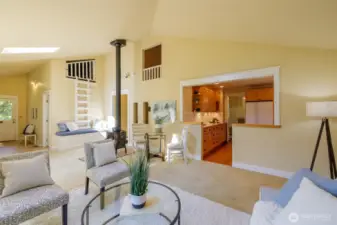 To the left - the utility room and "mud room" style space where folks can unload from the day coming in from the back porch. Up above? A secret play room littles will love, accessed from an upstairs bedroom.