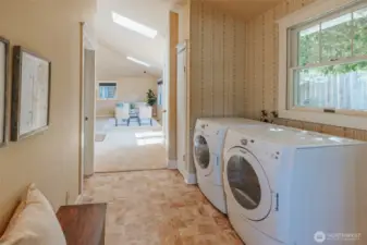Convenient utility room space, plus a half bath adjoins here as well!