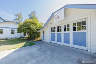 Even the garage exudes historic charm. Paneled doors move along a track for access...