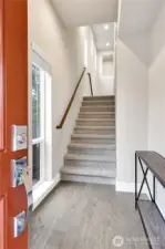 Front door entry with beautiful brand new carpet!