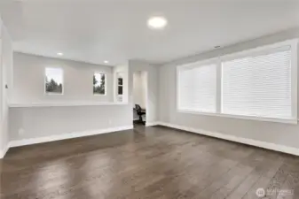 Huge great room with gas fireplace and view of bonus office nook!