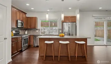 Open gourmet quartz kitchen.