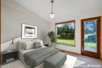 Bedroom 2 (windows and a door out to a common patio)