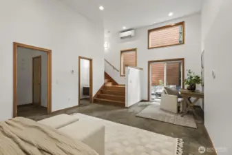 Soaring high ceilings and plentiful windows ensure this space doesn't feel like you're in a basement.