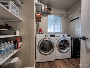 Walk-in pantry and mud room that leads to the garage