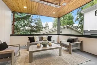 Outdoor covered living area offers year round enjoyment with speakers and an overhead gas heater!