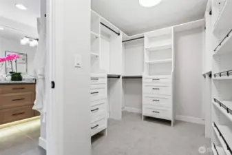 Primary bedroom walk in closet offers high end custom buildouts!