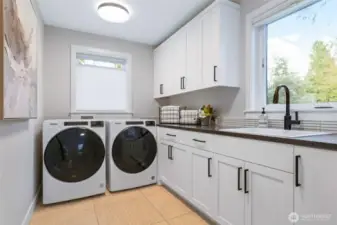 Upper level laundry room so you don't need to take your laundry downstairs! There is also a second washer and dryer hookup on the lower level.