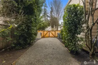 Side Yard Includes Gated Fence to Front Yard and Man Door Access to Garage