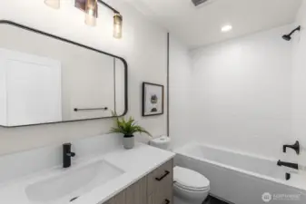 Fully equipped ensuite bathrooms feature extended vanities, full tubs with floor to ceiling tile & luxury lighting/hardware packages.