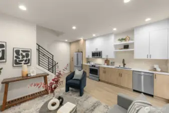 The open-concept living, dining, and kitchen areas create breezy and inviting spaces for entertaining.