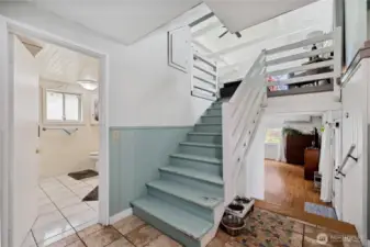 The lower level in the main home. Bathroom on the left and bonus room with 2nd kitchen straight ahead.